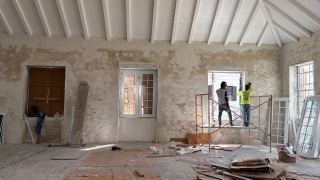 In-progress preservation work: new hurricane-rated windows installed at Fifteenand9Main